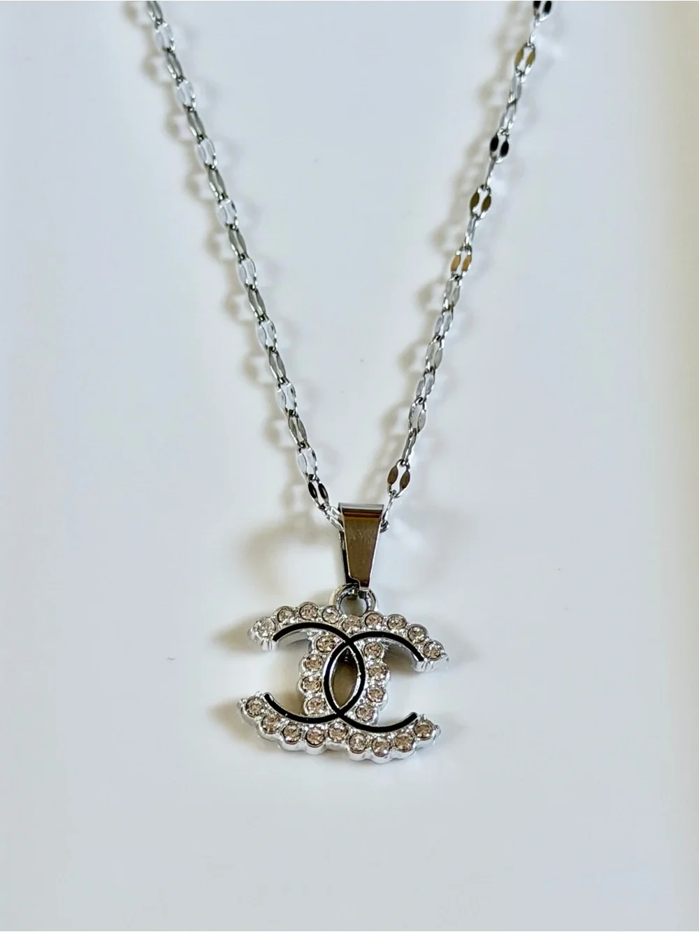 Crystal-Embellished Interlocking Logo Pendant Necklace in Silver